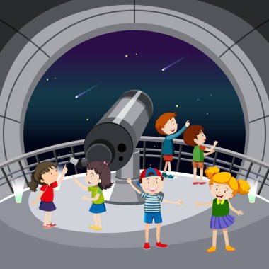 Birçok çocuğun yıldız resimlerine baktığı astronomi teması