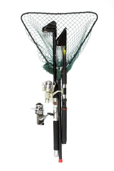 Fishing rods with reels and landing net. — Stock Photo, Image