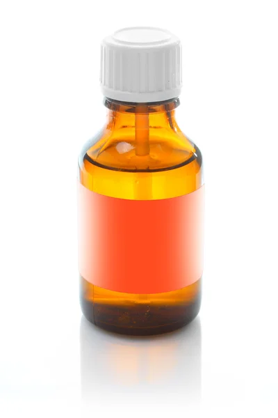 Brown medicine bottle with an empty label. — Stock Photo, Image