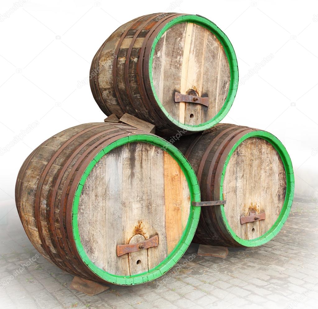 Three vintage beer barrels.