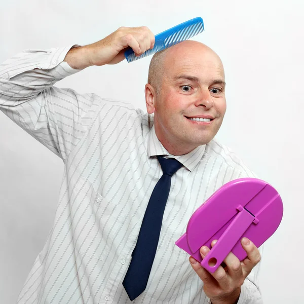 Funny picture of a hairless businessman with mirror - forever beautiful — Stock Photo, Image