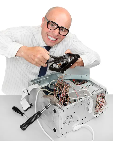 Funny repairman with computer. Under construction concept — Stock Photo, Image