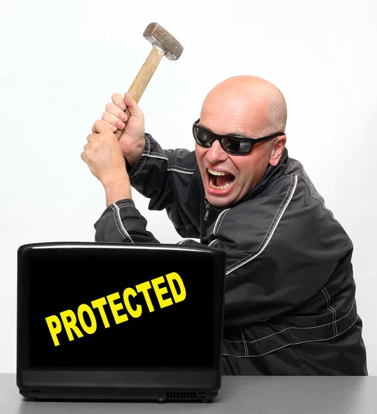 Frustrated hacker and protected laptop — Stock Photo, Image