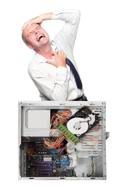 Wütender Geschäftsmann mit zerstörtem Computer — Stockfoto