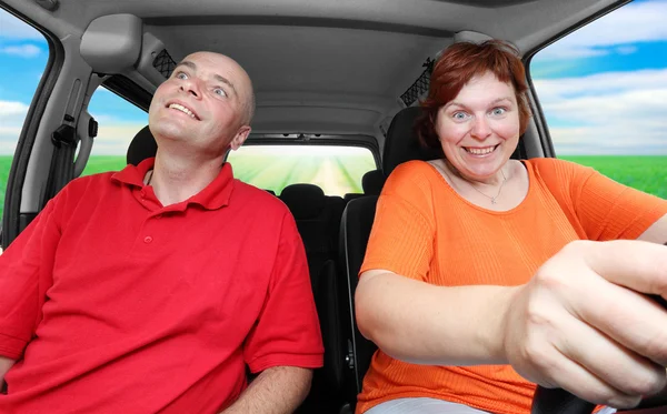 Funny picture of crazy family riding on a holiday — Stock Photo, Image