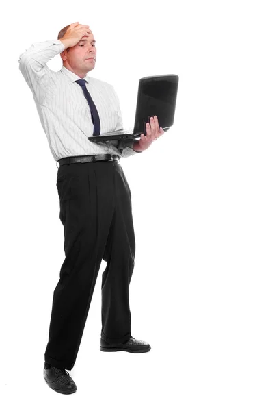 Frustrated businessman with laptop — Stock Photo, Image