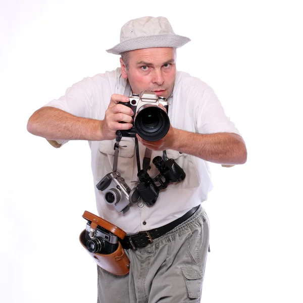 Fotografo con macchine fotografiche vestite con tuta da safari. Studio girato isolato su bianco — Foto Stock