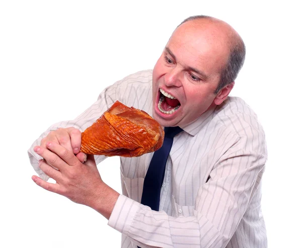 Hungriga affärsman äta skinka. — Stockfoto