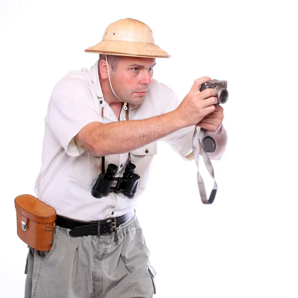 Fotógrafo com câmara vestida de fato de safári. Estúdio tiro isolado em branco — Fotografia de Stock