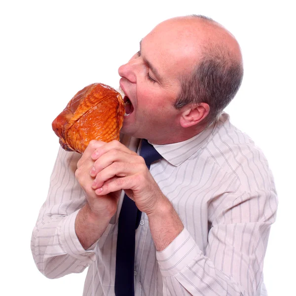 Hombre de negocios hambriento comiendo jamón . —  Fotos de Stock