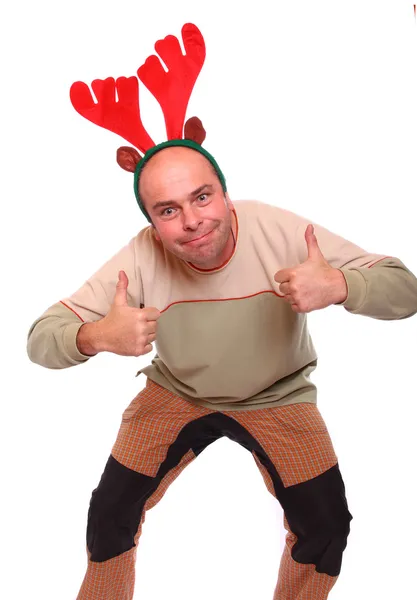 Joven feliz con atuendo de reno. Imagen divertida ideal para la Navidad y la tarjeta de felicitación de año nuevo . — Foto de Stock