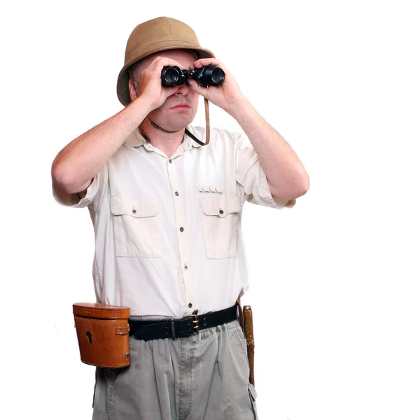 Park ranger watching closely wildlife with his binoculars. Studio shot isolated on white background — Stock Photo, Image