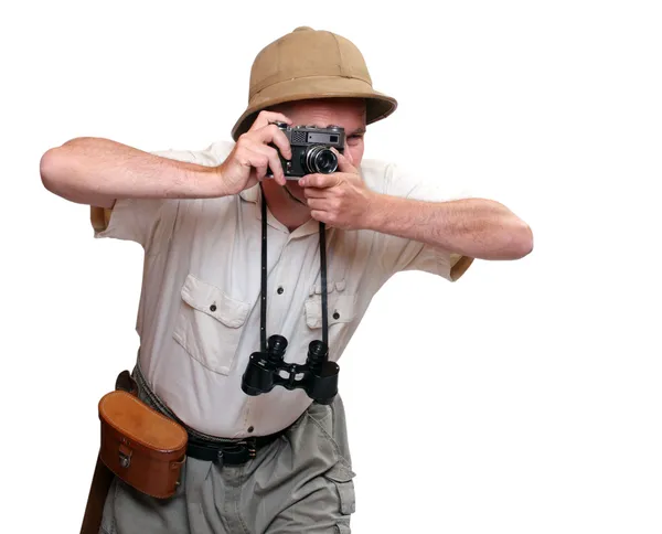Φωτογράφος με κάμερα ντυμένος με κοστούμι για τροπικά προορισμού. στούντιο πυροβόλησε απομονωθεί σε λευκό φόντο. — Φωτογραφία Αρχείου