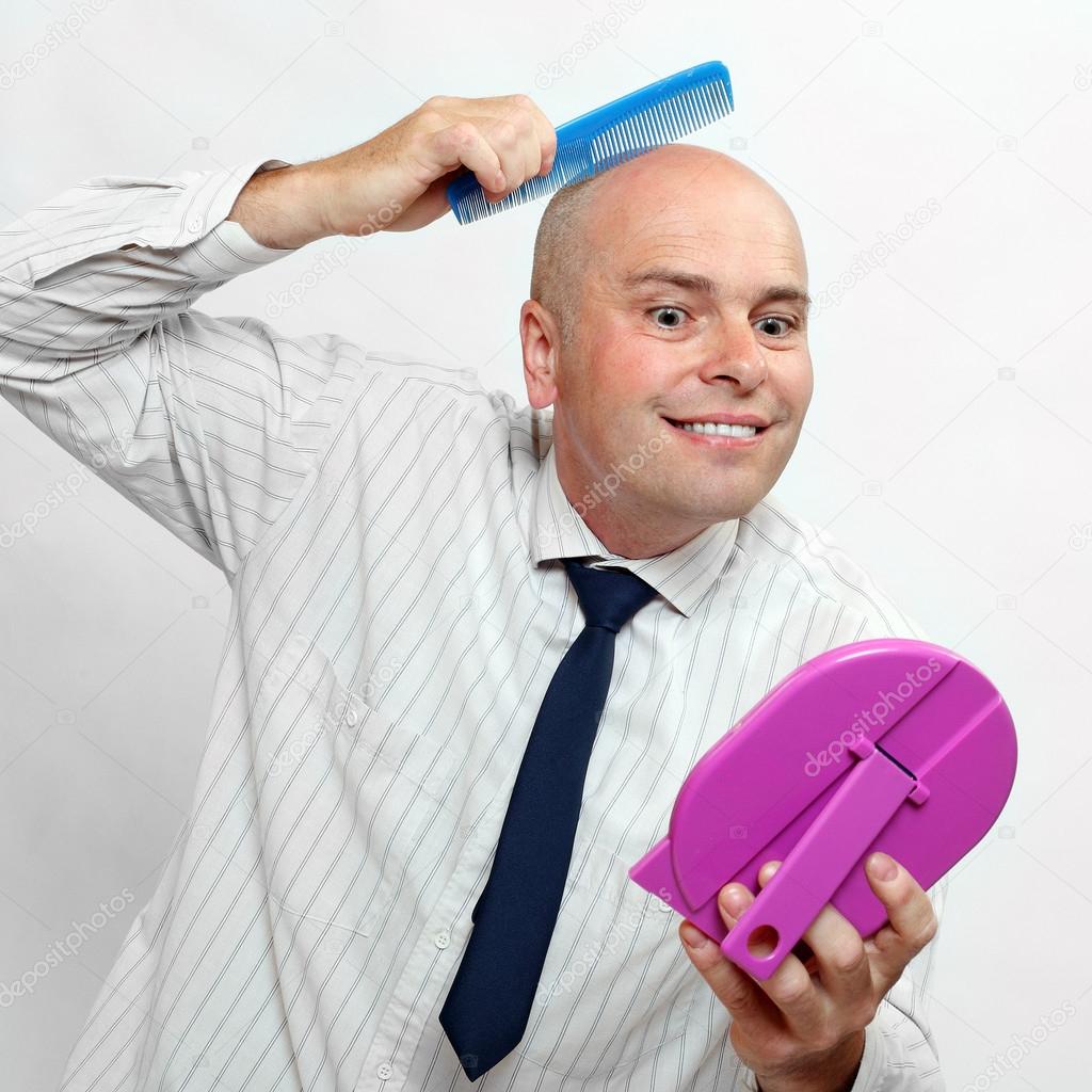 Funny picture of a hairless businessman with mirror - forever beautiful