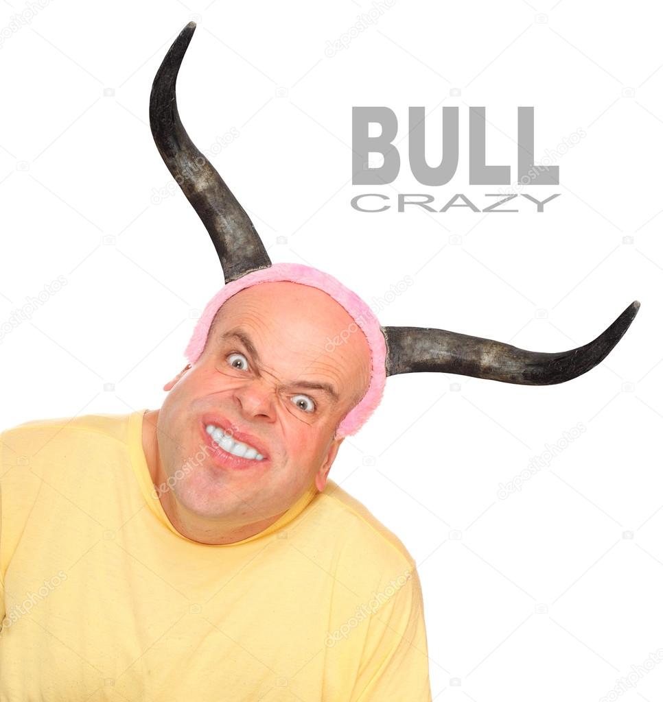Funny picture of an powerful young man with bulls horns.