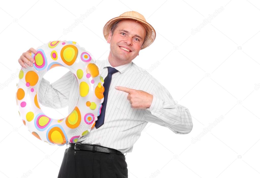 Happy businessman going on vacation with his life ring