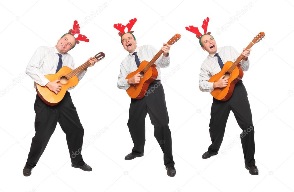 Crazy musicians in business suit with guitar singing. Christmas and new year party concept.