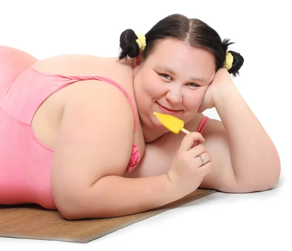 Overweight woman with sweet ice lolly. — Stock Photo, Image