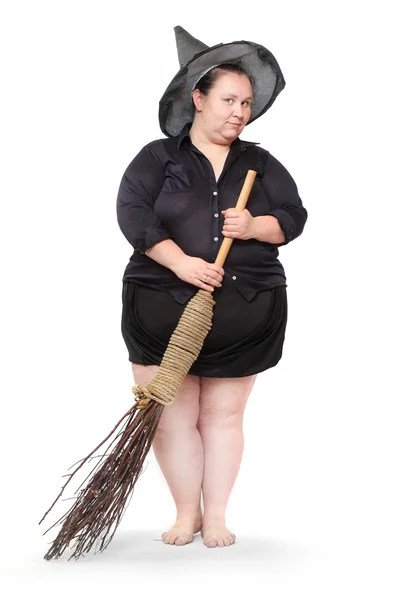 Funny obese witch with her magic broomstick. Haloween concept. — Stock Photo, Image
