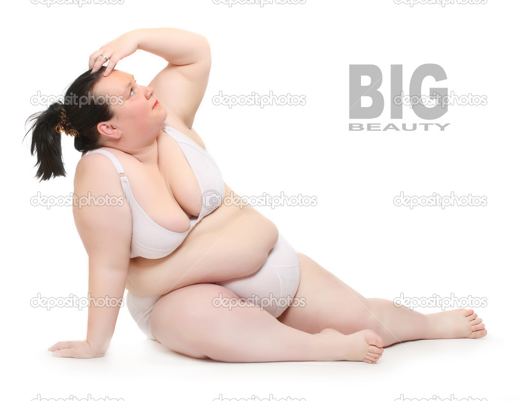 Foto de Fat woman in underwear or lingerie trying dresses at home.  Beautiful lady preparing for trip, journey or voyage. Woman posing with  luggage or suitcase. do Stock