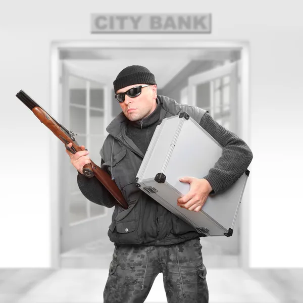 Dangerous gangster with stolen money fleeing from the bank. — Stock Photo, Image