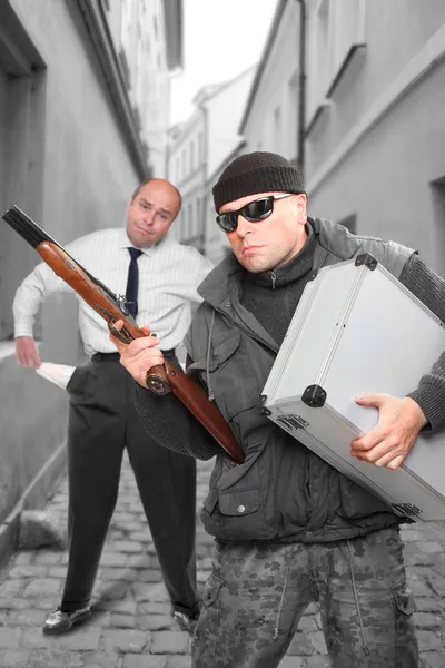 Gangster with shotgun and his victim — Stock Photo, Image