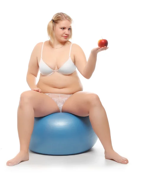 Overweight woman with fresh ripe apple. — Stock Photo, Image