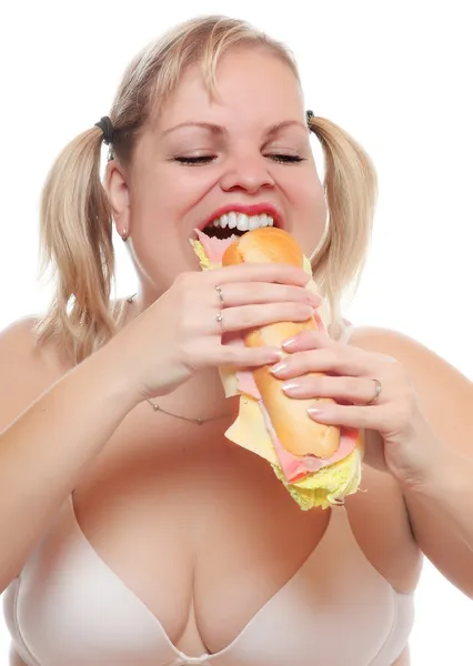 Imagen divertida de un hambriento bocadillo de grasa comiendo grande con jamón . — Foto de Stock