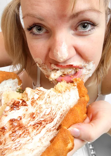 The girl greedy eats sweet pie — Stock Photo, Image