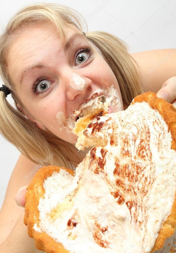 The girl greedy eats sweet pie. Unhealthy lifestyle (bulimia) concept.