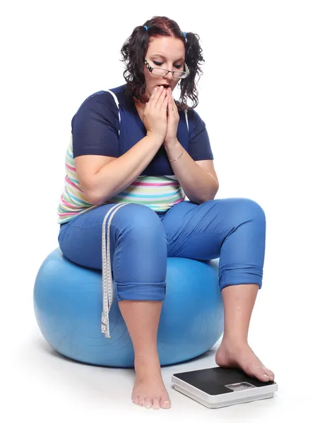 Frustrated woman with a weighing machine. — Stock Photo, Image