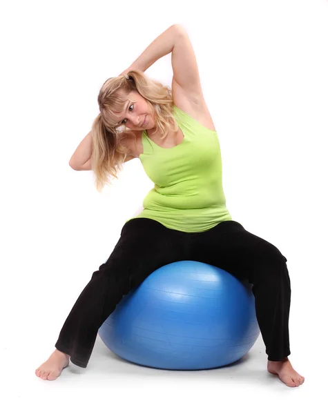 Overweight young woman exercise on fitness ball — Stock Photo, Image