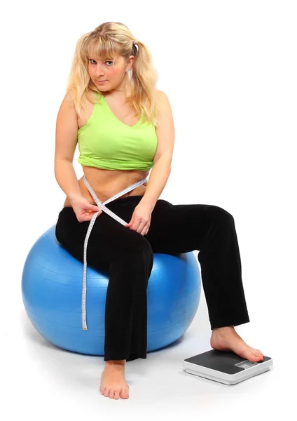 Depressed overweight woman measure her waist belly by metre-stick. — Stock Photo, Image