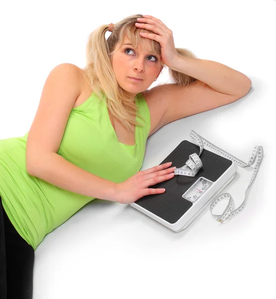 Pretty woman with bathroom scale. — Stock Photo, Image