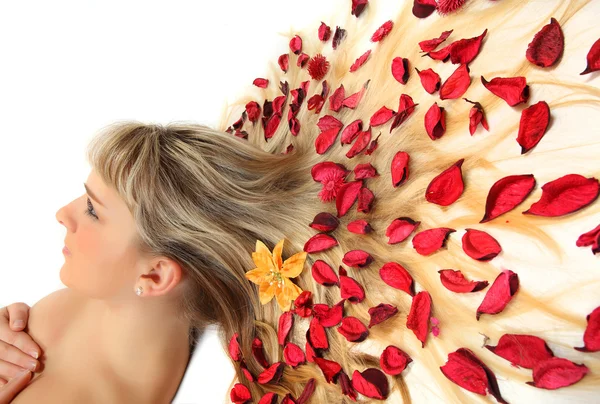 Young beautiful woman with dried herbs on her long hair — Stock Photo, Image