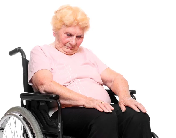 Elderly paraplegic woman sitting in a wheelchair — Stock Photo, Image