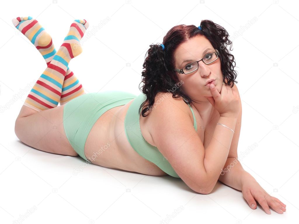 Overweight woman dressed in funny lingerie Stock Photo by