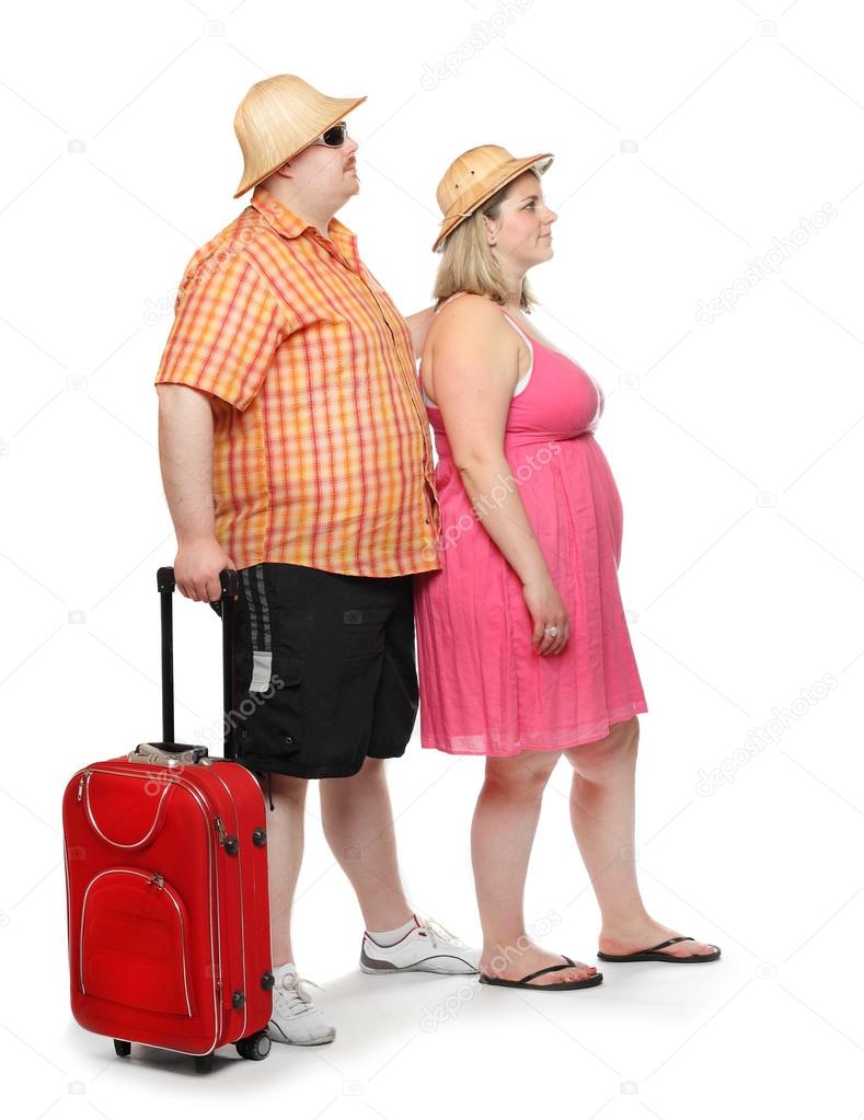 Funny obese couple going to holidays.