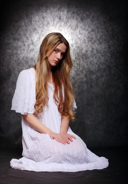 Romantic style picture young beautiful girl dressed in white shirt tunic with glory (halo) — Stock Photo, Image