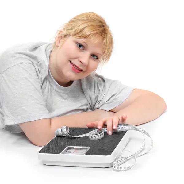 Mujer con sobrepeso sobre un fondo blanco . — Foto de Stock