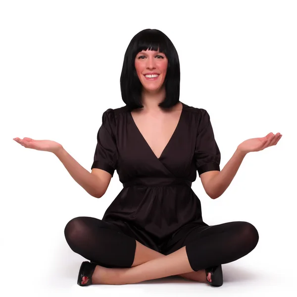 Jovem mulher de negócios atraente meditando em ioga lótus posar no chão . — Fotografia de Stock