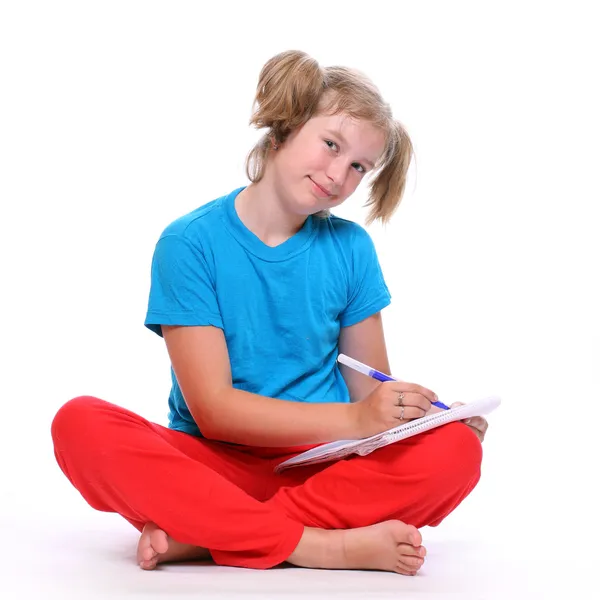 Retrato de uma menina bonita escrevendo — Fotografia de Stock