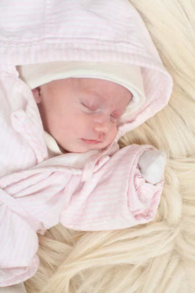 Cute baby on the fur. — Stock Photo, Image