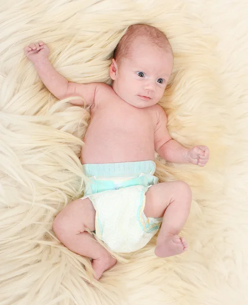Cute baby on the fur. — Stock Photo, Image