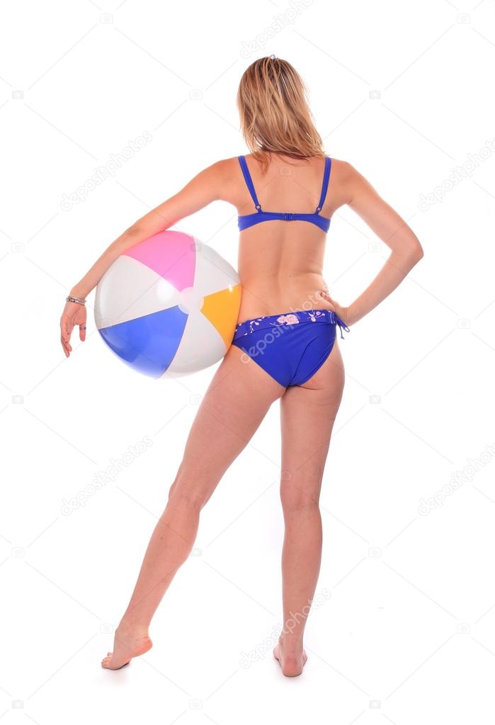 Young woman in swimsuit with ball