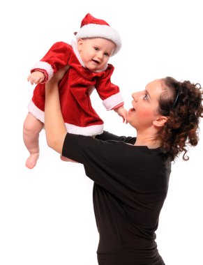 şirin bebek ile mutlu genç anne Noel Baba gibi giyinmiş