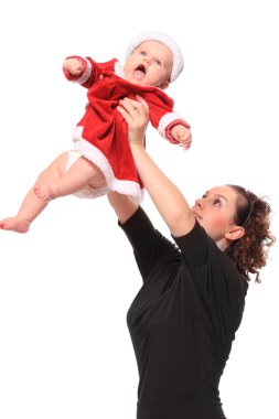 şirin bebek ile mutlu genç anne Noel Baba gibi giyinmiş