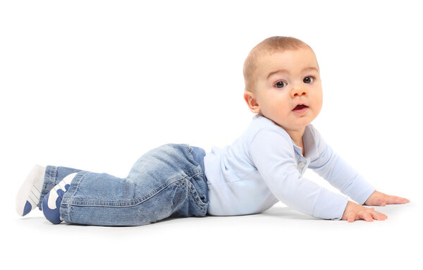 Funny toddler boy playing on a white background.