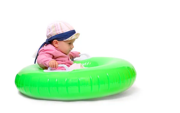 Happy baby playing in rubber dinghy. — Stock Photo, Image