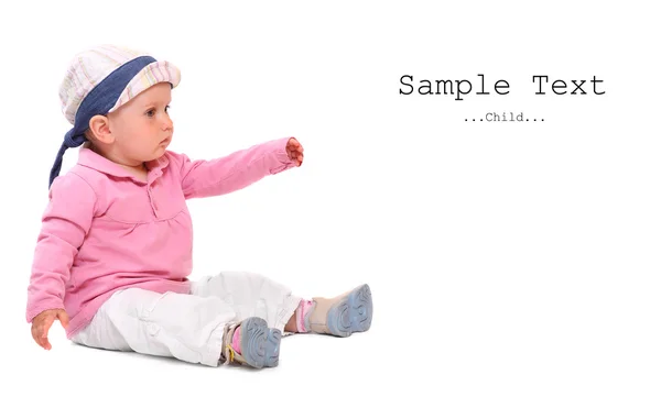 Little child sitting on a white background. — Stock Photo, Image